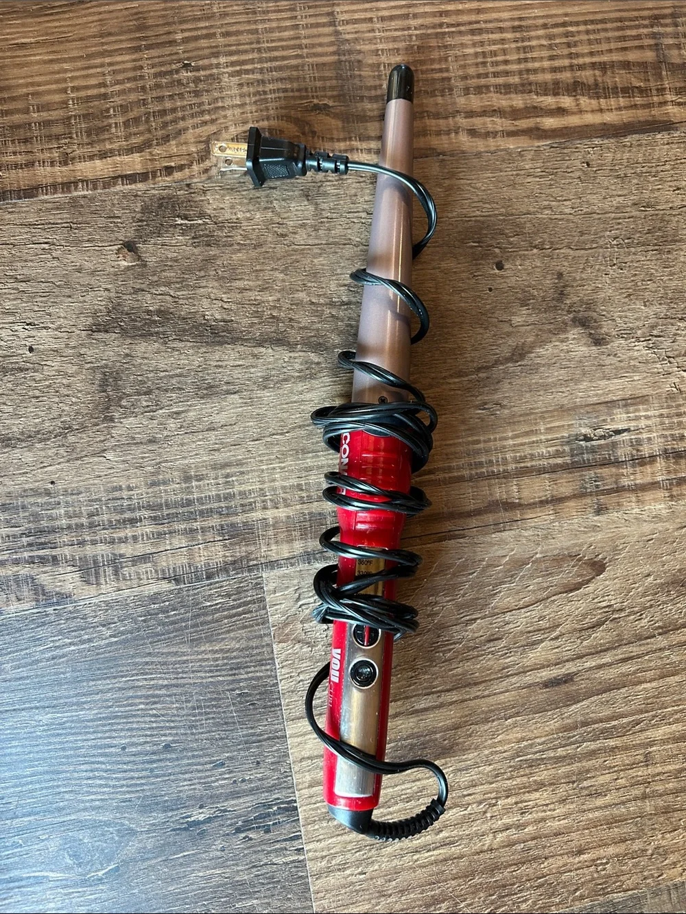 Conair tapered curling wand.
